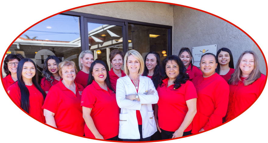 Dr. Fortney with the Hidden Valley Orthodontics team behind her outside of the office